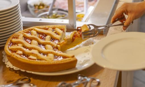 A fragrant tart is served in a warm, inviting buffet.