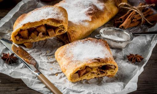 Crisp apple strudel, powdered sugar, warm spices, and a cozy atmosphere.